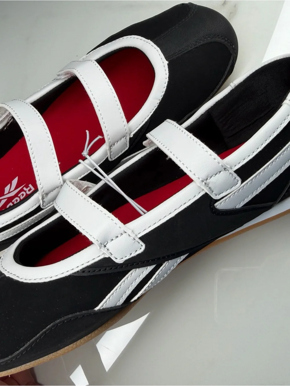 Reebok White and Black Mary-Jane Sneakers with Red Insole Accents